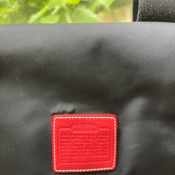 COACH canvas backpack and COACH leather wallet.